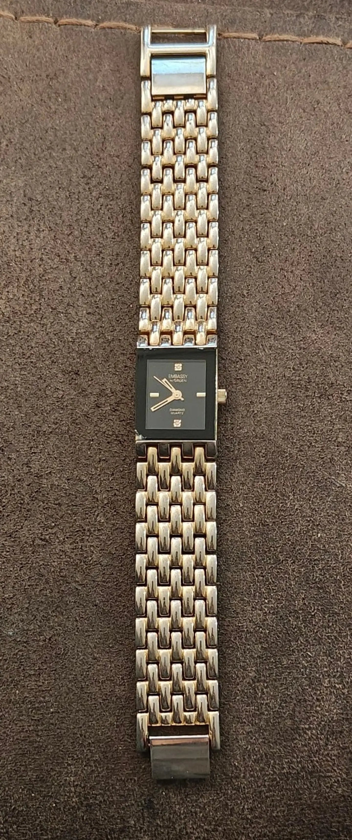 1990s Embassy by Gruen Gold Tone With Black Dial Ladies Diamond Accent Watch