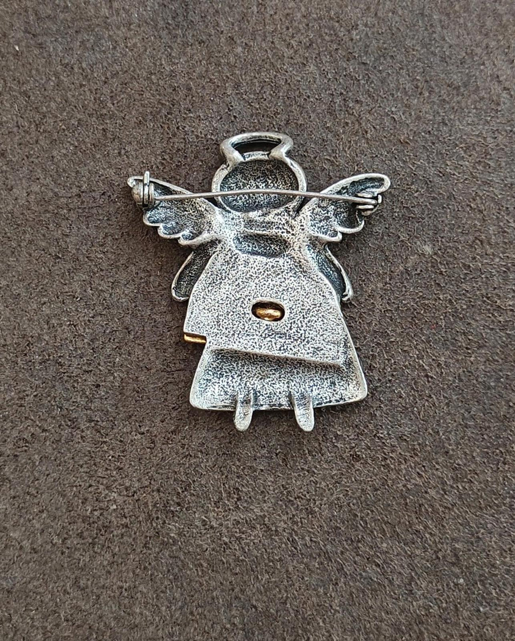 Silver angel brooch back view with pin stem and catch, winged design