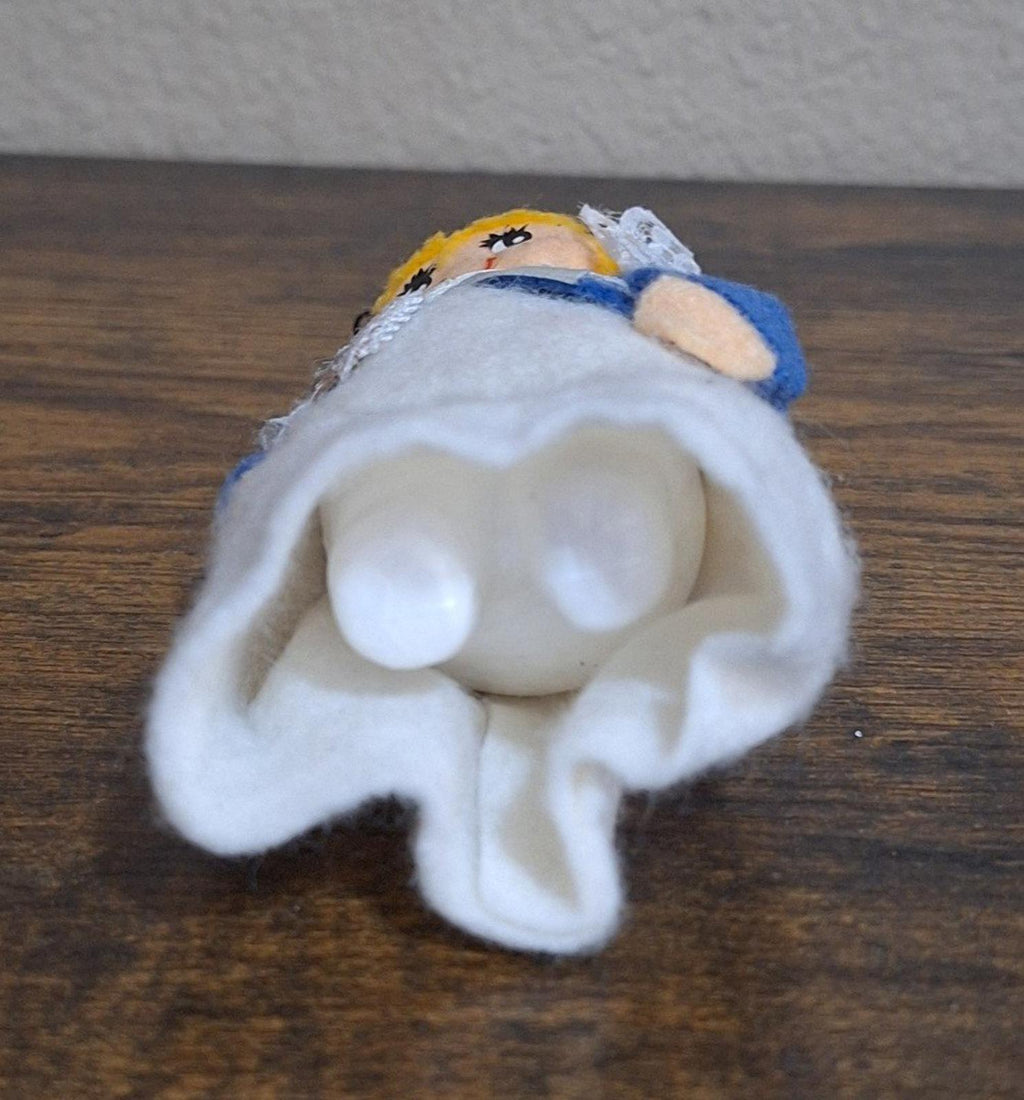 Handmade pilgrim girl ornament figurine underside view with hanging loop and white trim