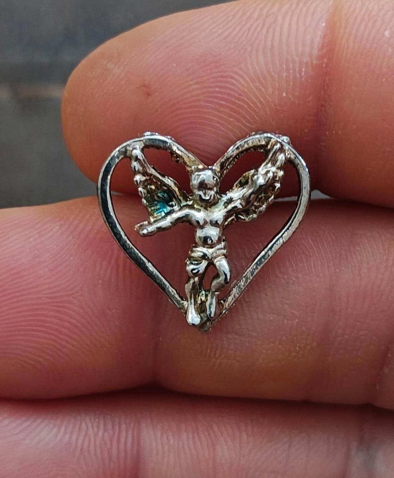 1980's Silver Tone Angel Inside A Heart Pin