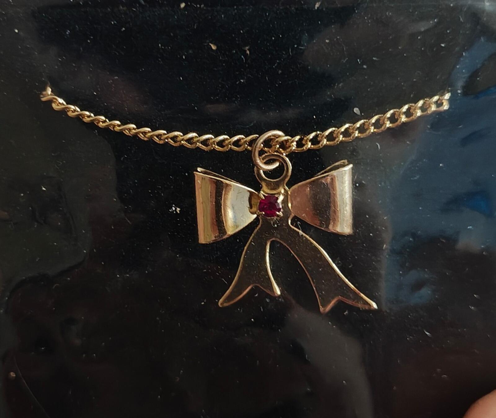 1980s 14k Gold Tone Bow Pendant Necklace With Vibrant Red Stone