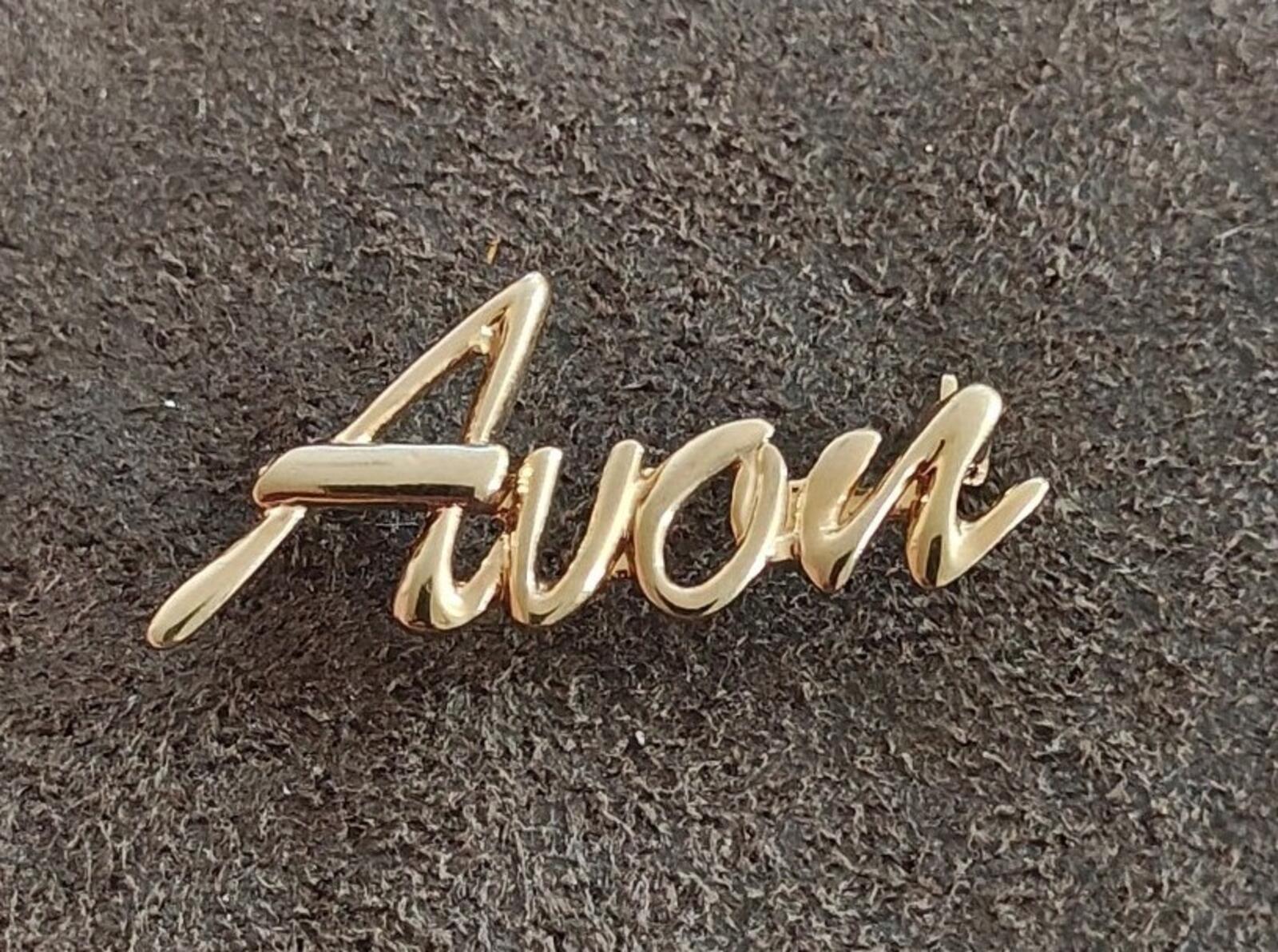 1980s/90s  Avon Gold Tone Cursive Logo Pin