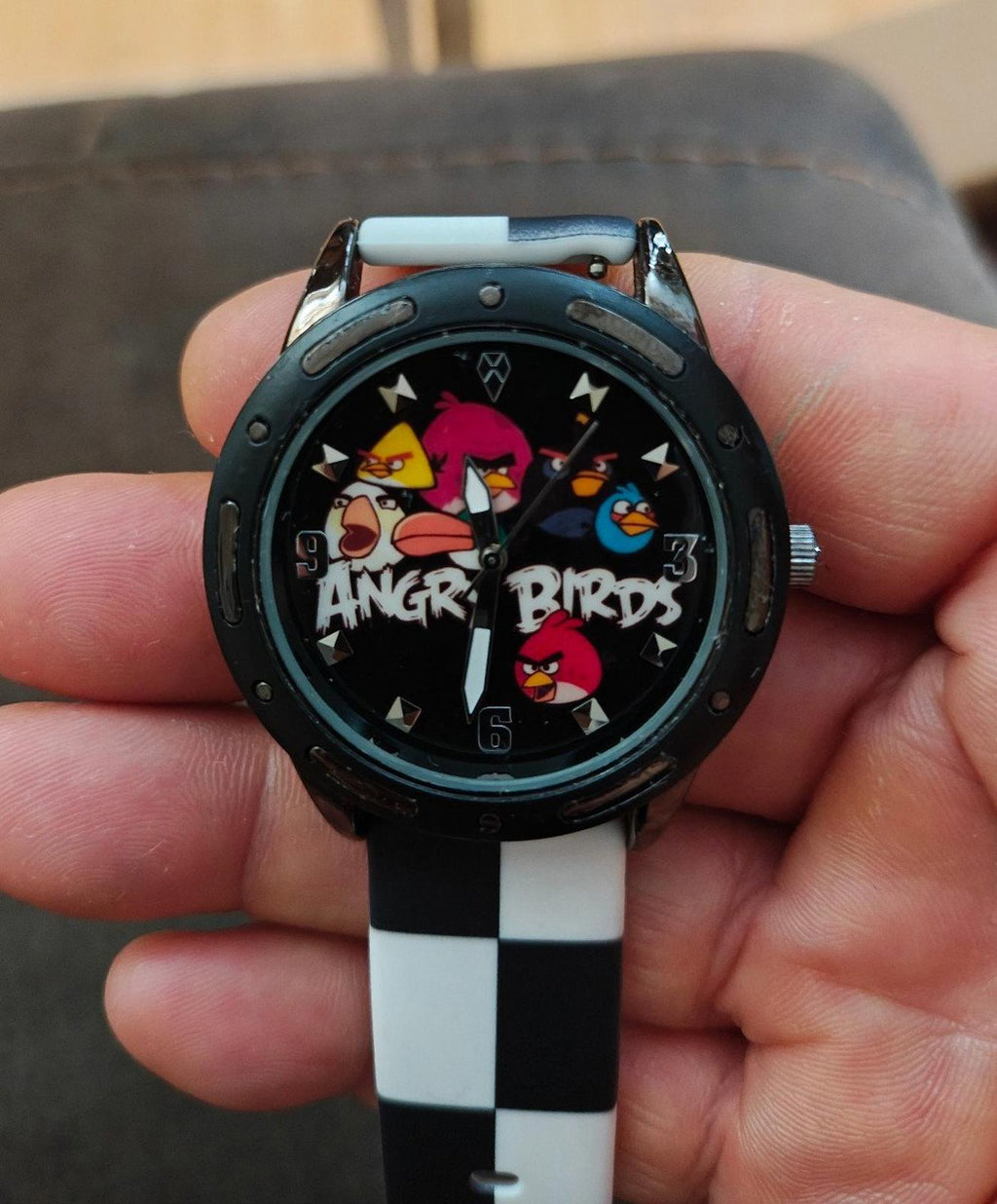 Checkered silicone band watch featuring Angry Birds-themed dial and silver-toned bezel