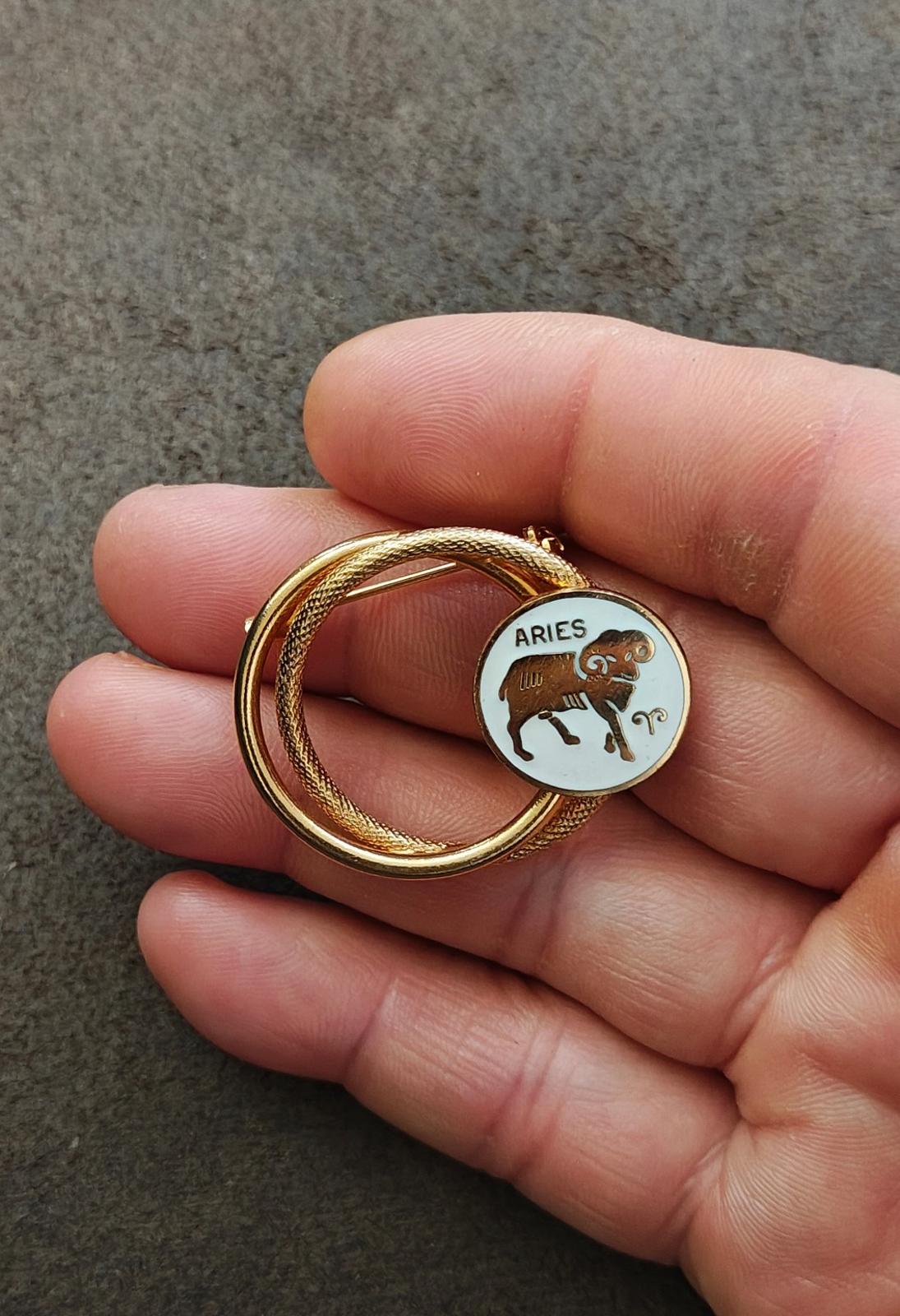 1970s Gold Tone Aries Zodiac Sign Double Circle White Enamel Brooch Pin