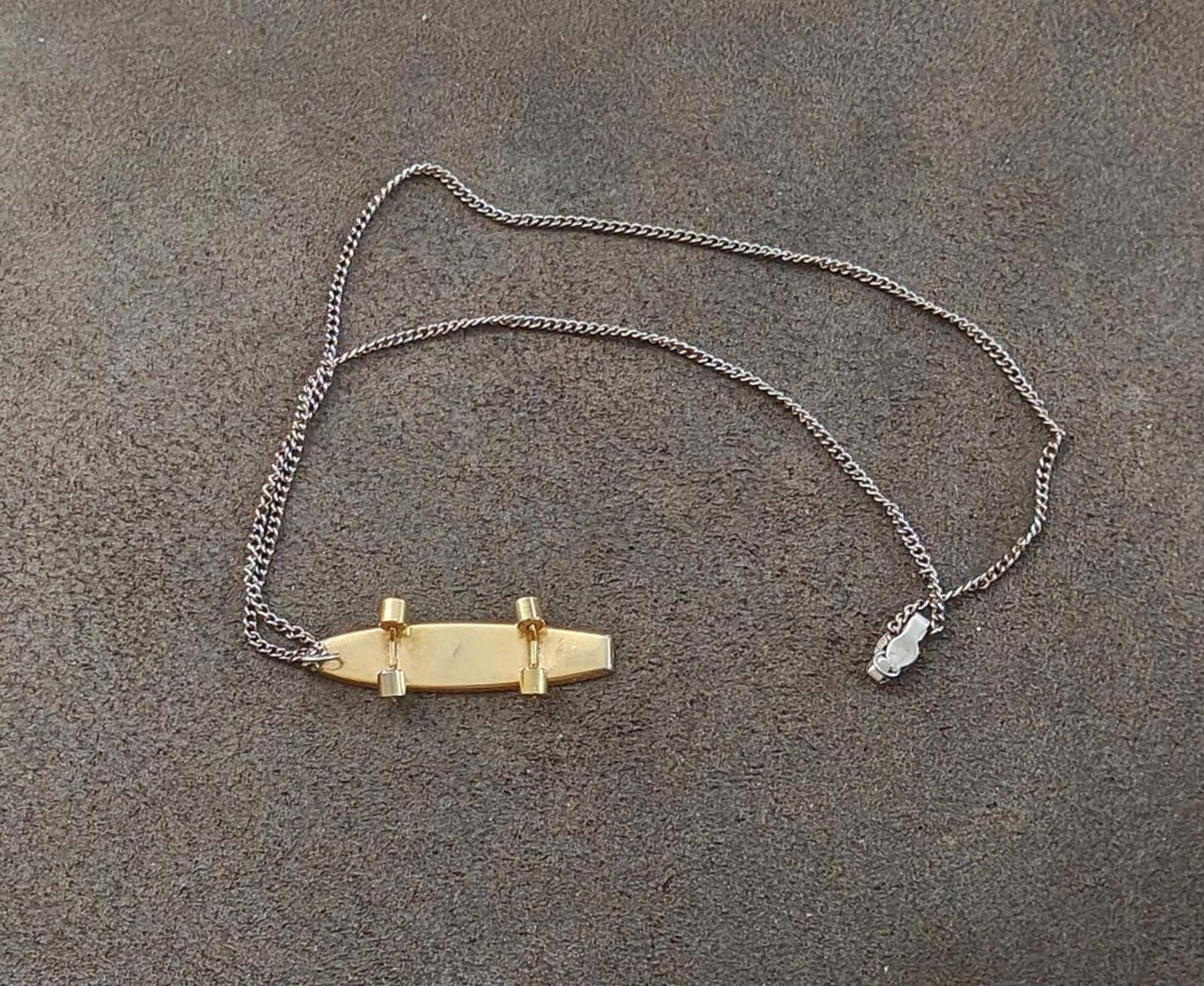 1980's MCM Starburst Skateboard Pendant Necklace with moveable wheels