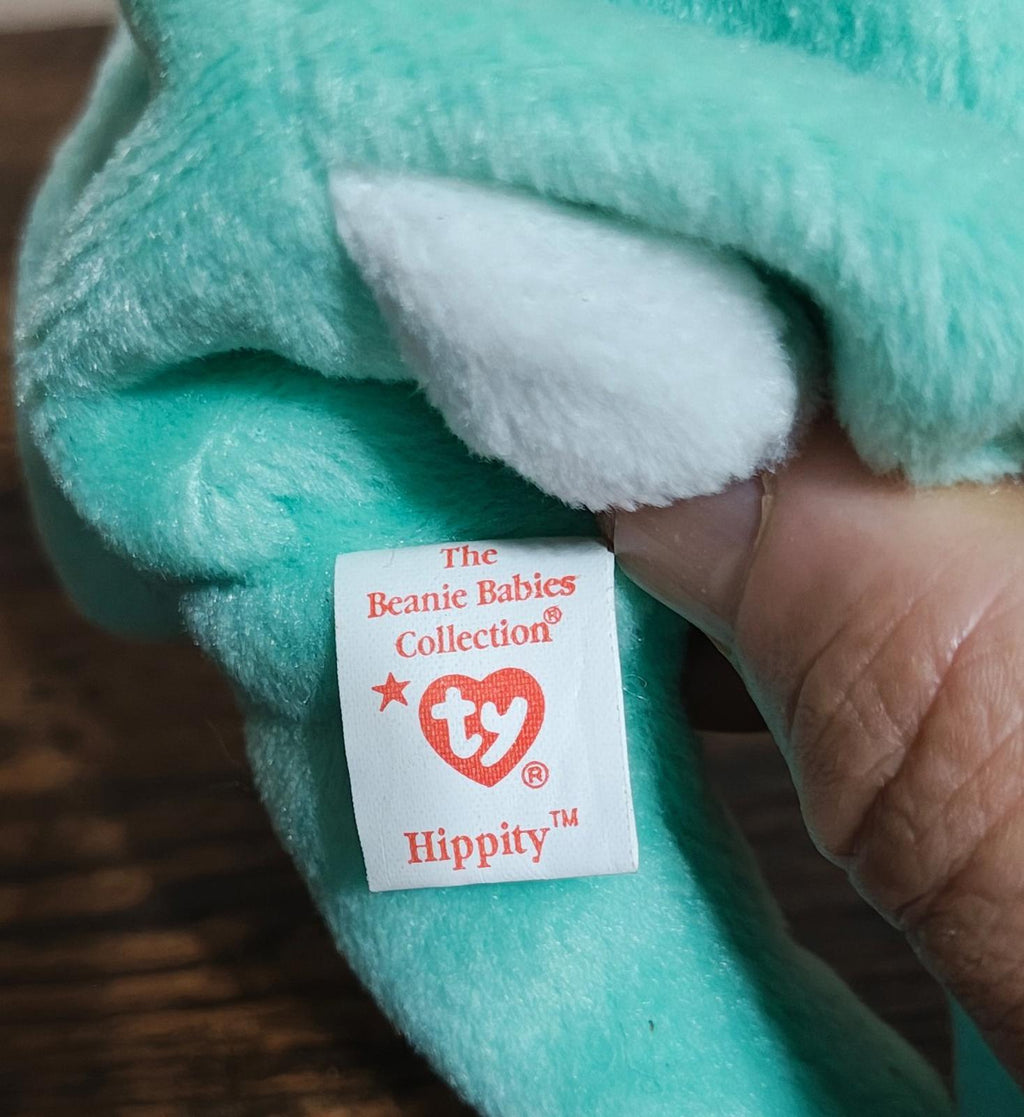 Teal plush bunny leg with Ty Beanie Babies Collection swing tag reading "Hippity"