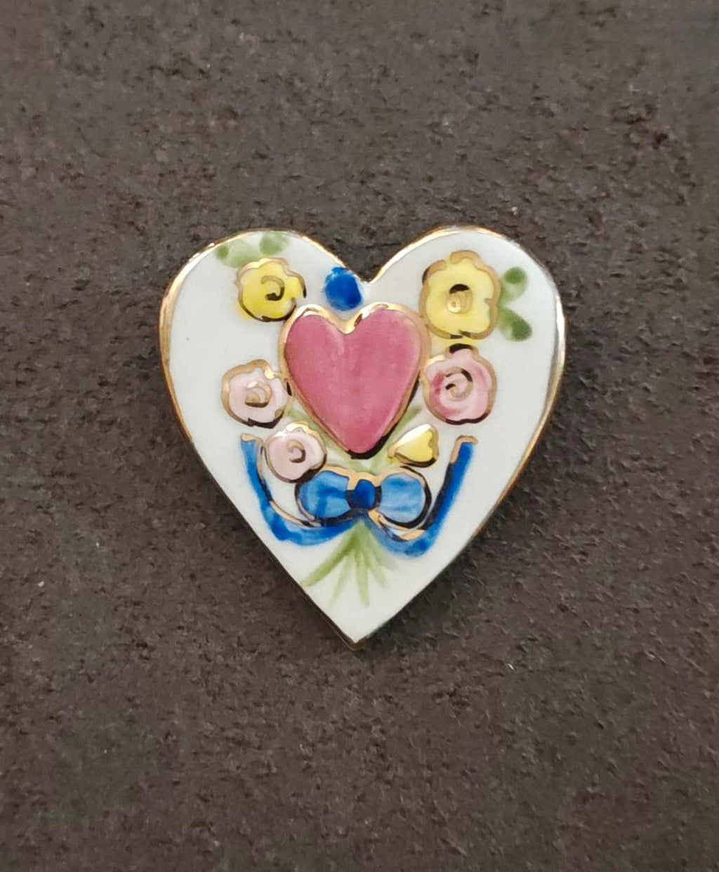 Heart-shaped ceramic brooch pin, pink heart surrounded by painted flowers and leaves