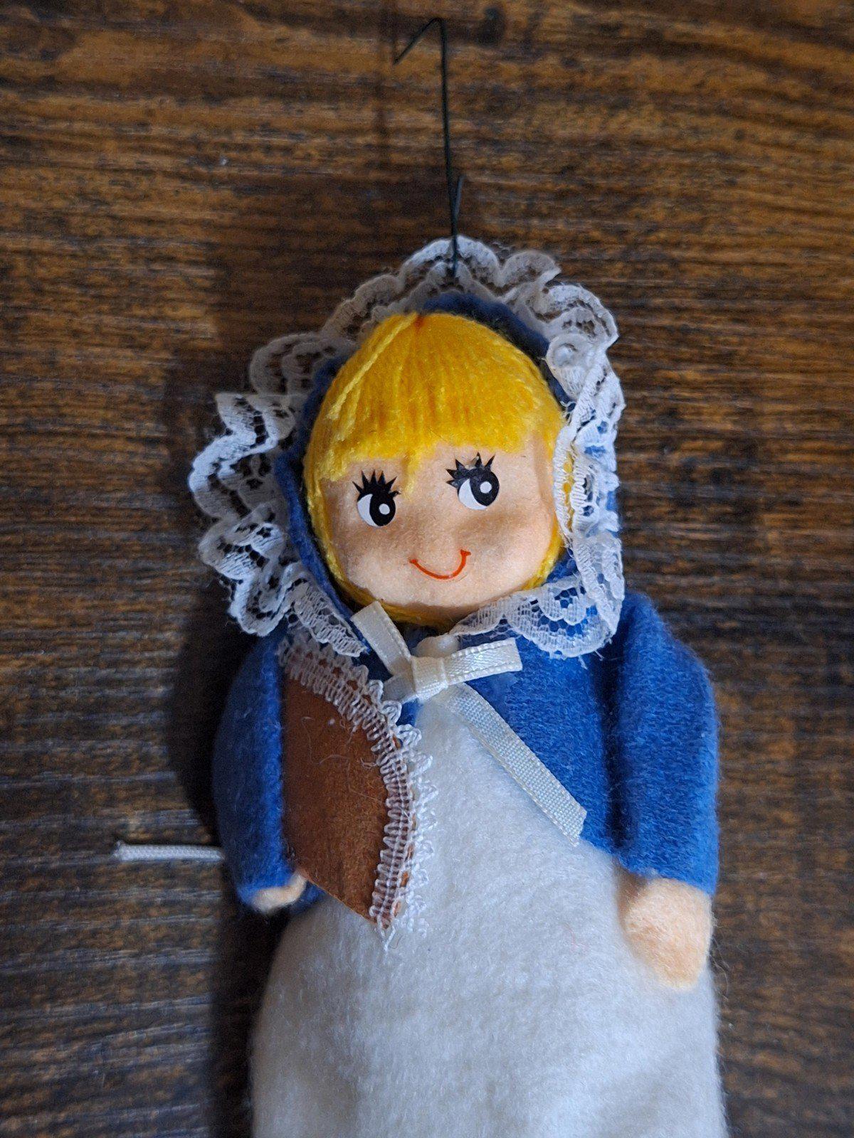 Handmade pilgrim girl ornament figurine face detail, blue bonnet with lace edging