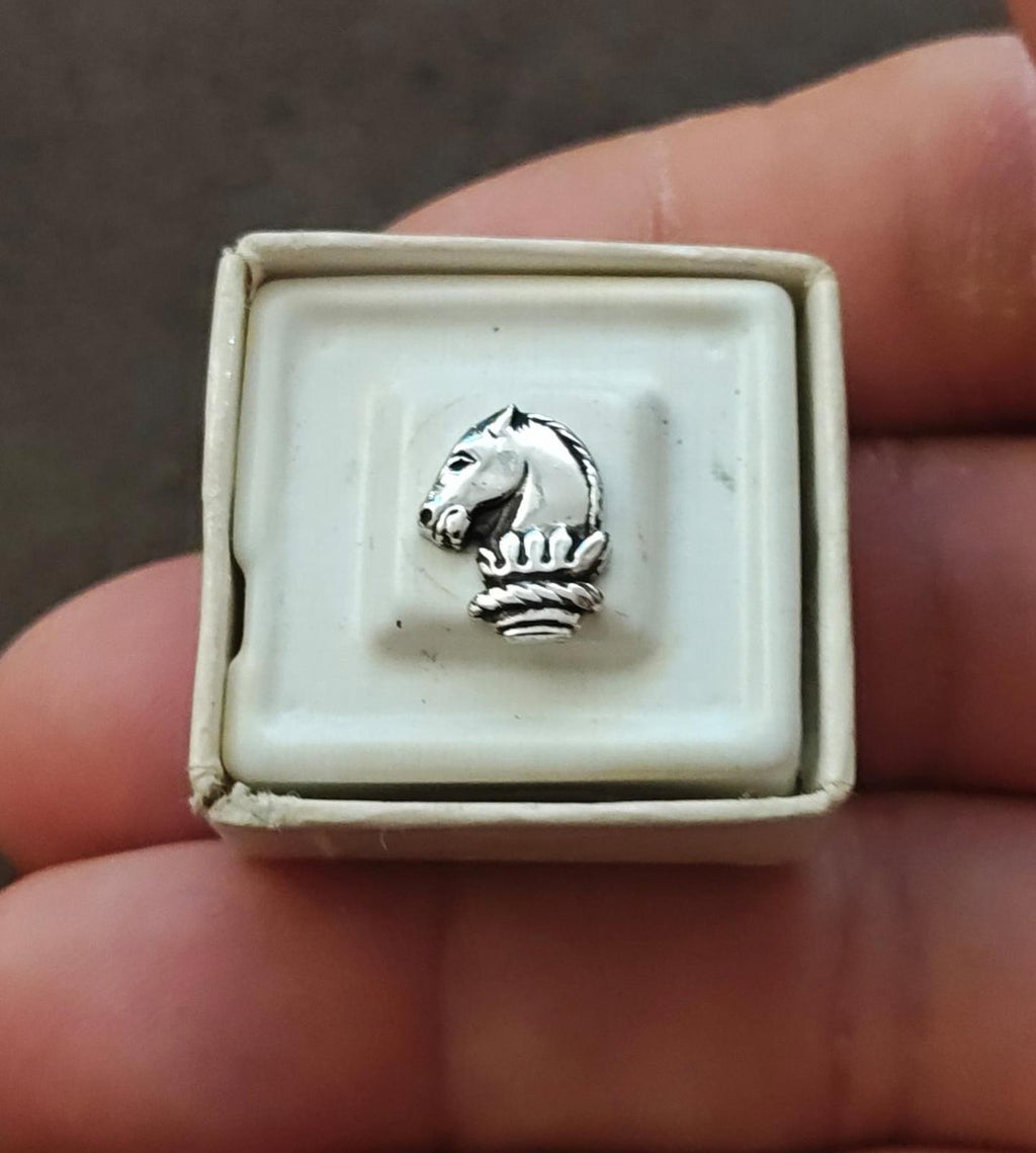 Silver-tone horse head tie tack pin in light bezel, textured mane and base
