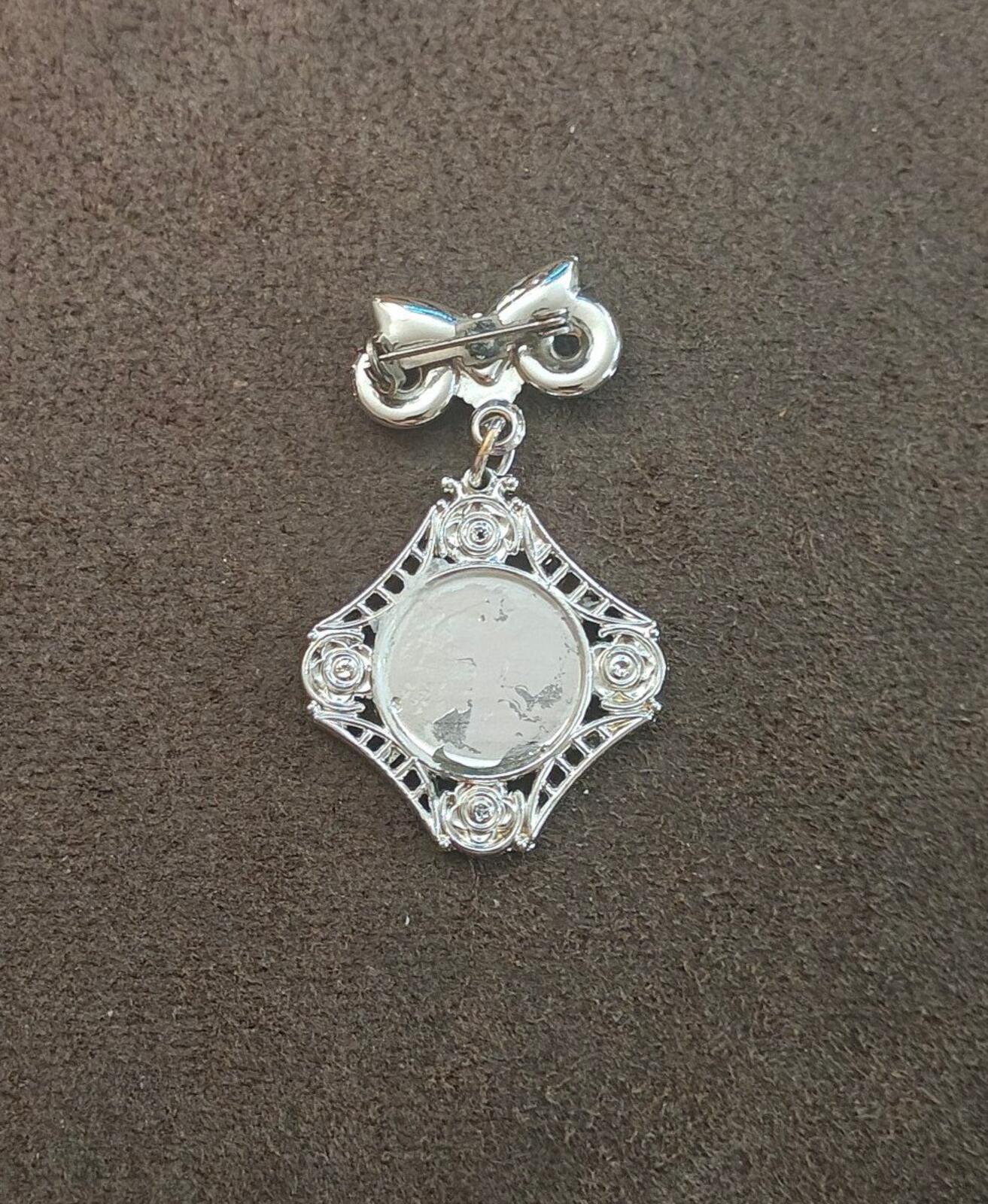 1980s Silver Tone Art Deco Style Bow Clock Motif Dangle Brooch