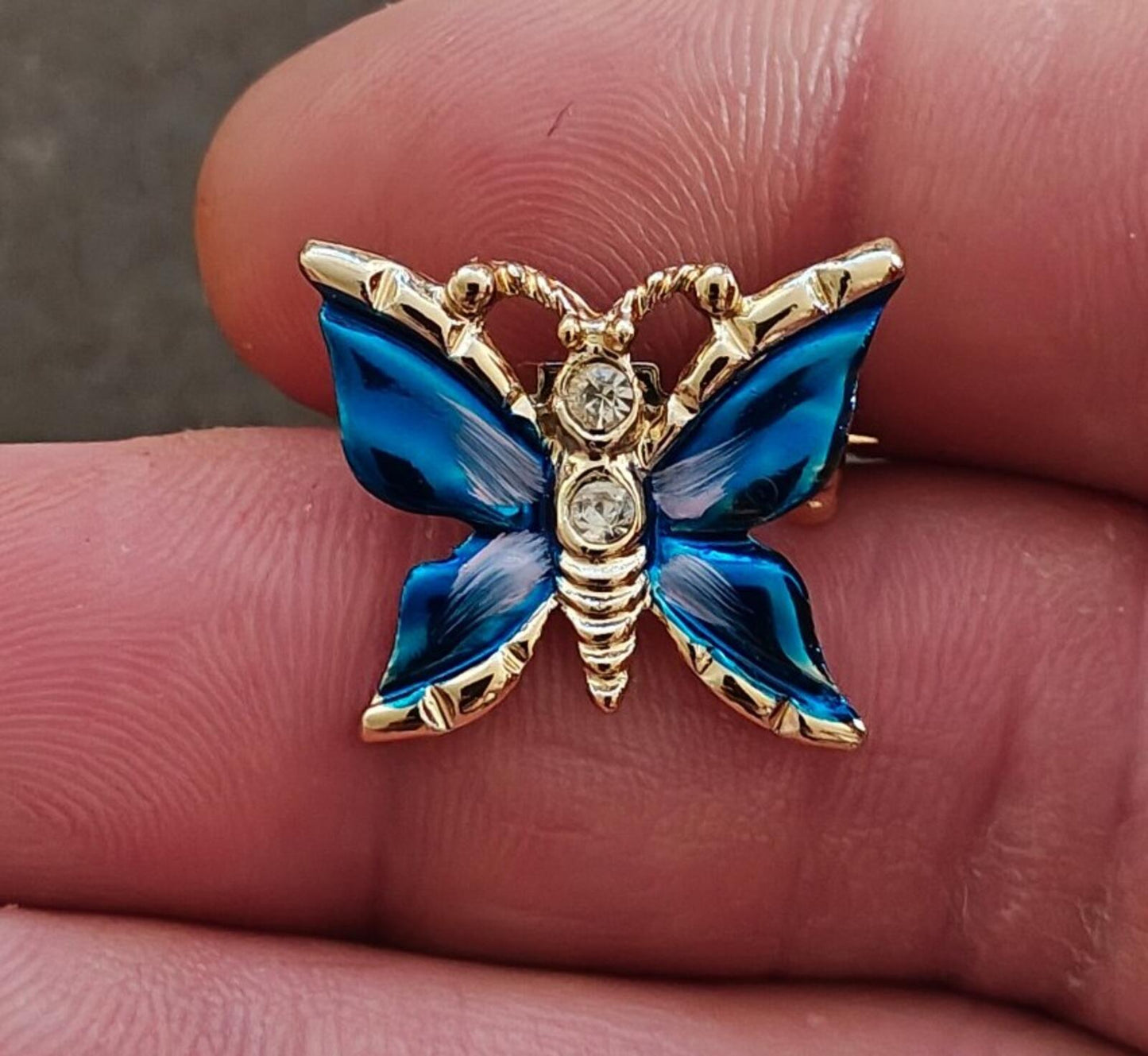 1980s Gold Tone Blue Enamel Butterfly Brooch Accented With Clear Rhinestones