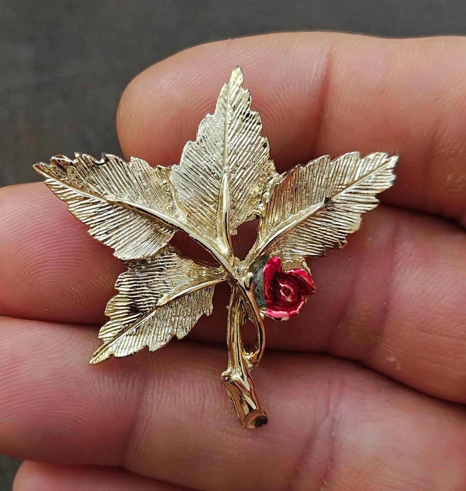 Gold-tone leaf cross pin brooch with red rose and Mary medallion