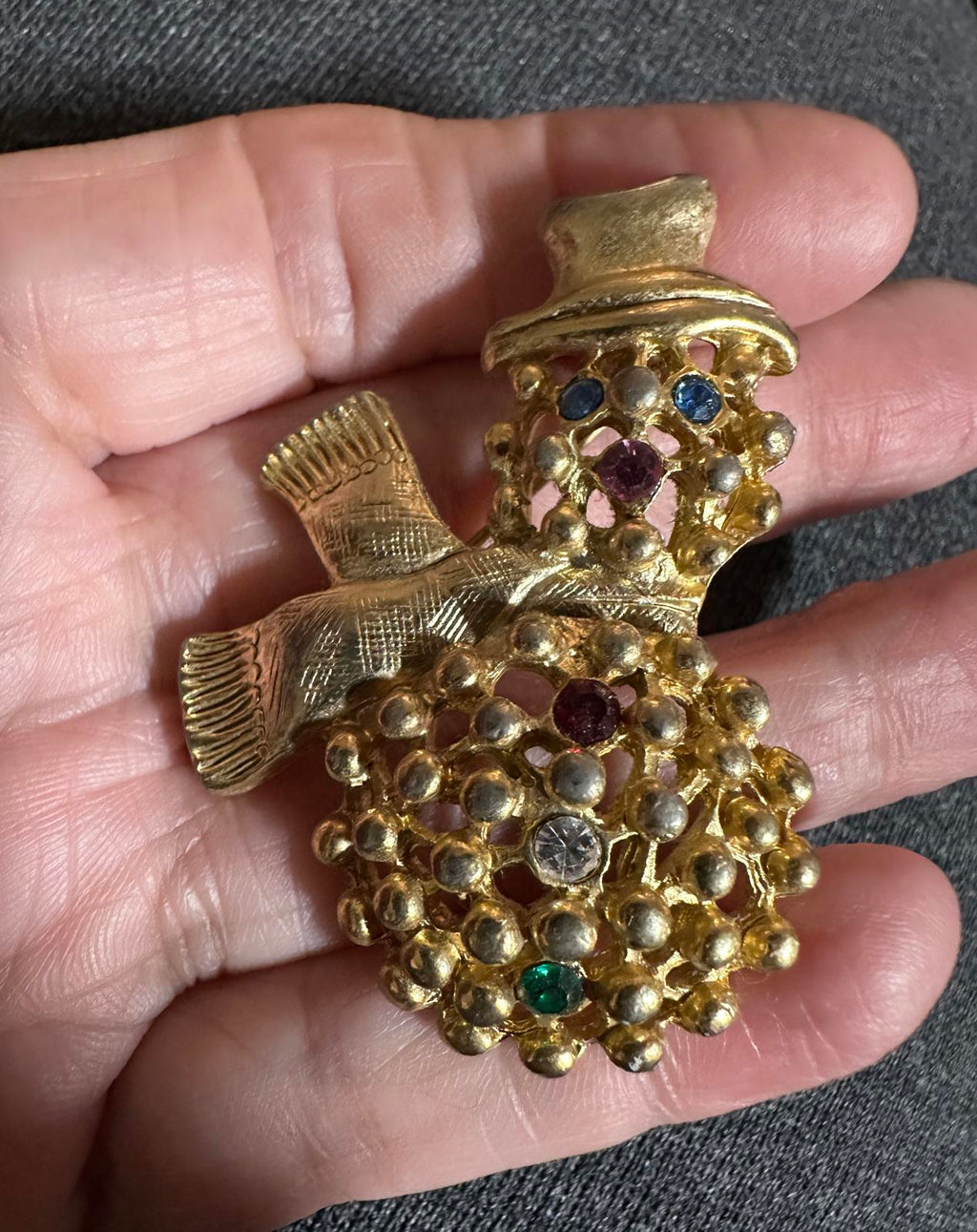 Gold-tone snowman brooch with colorful rhinestone eyes and top hat