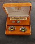 Gold-tone rhinestone cufflinks and tie stud set in open orange gift box