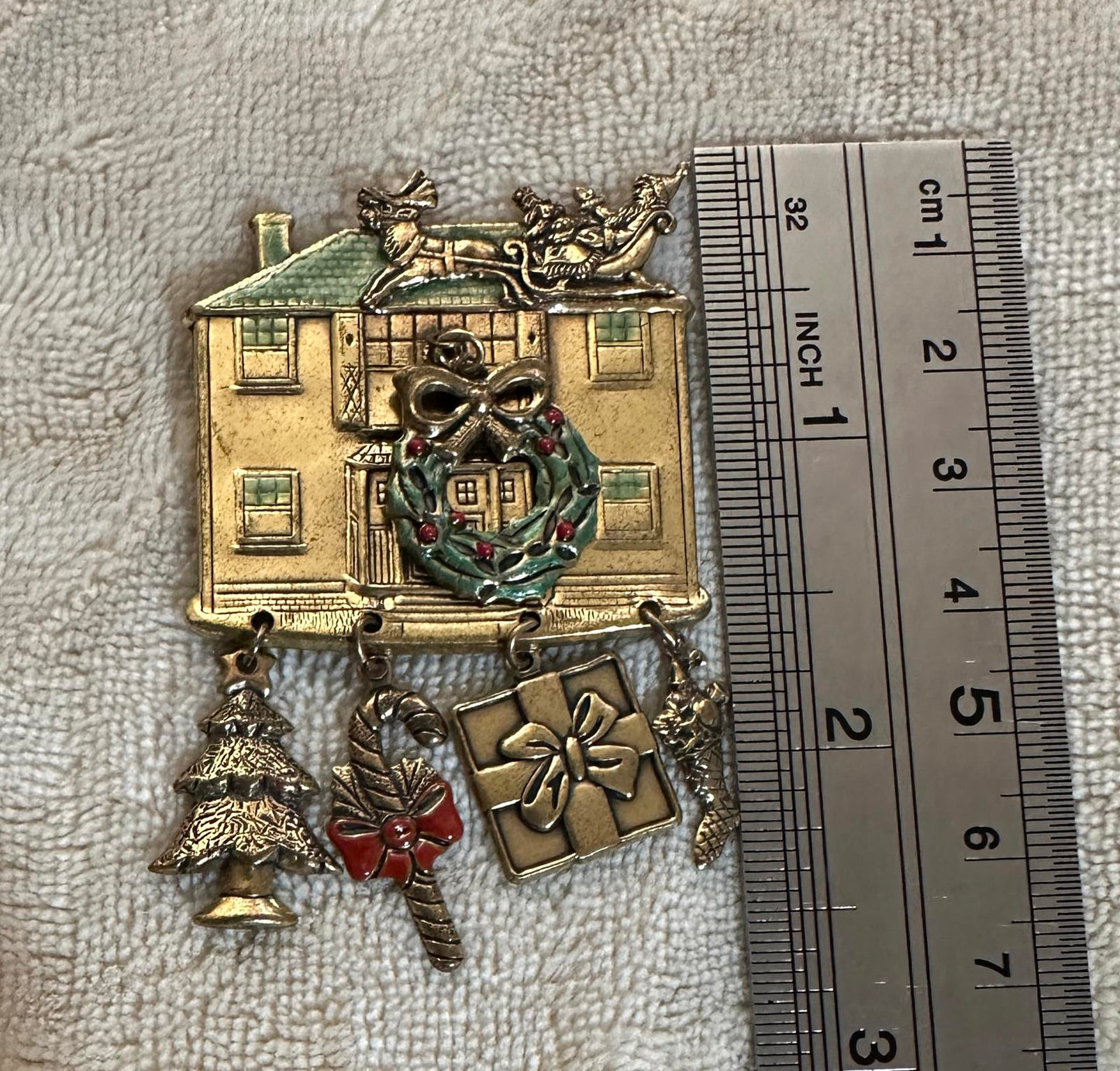 1980’s Christmas-themed House Brooch with dangling charms
