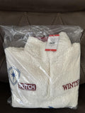 White XXL sherpa pullover with red collar and blue Stitch graphic, folded in package