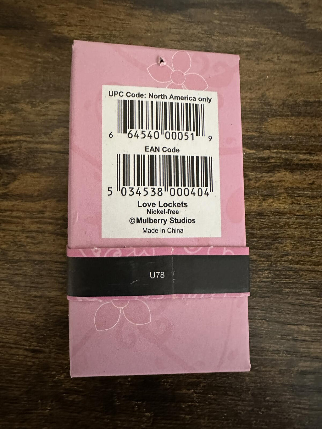 Silver-tone heart locket necklace gift box with barcode label on the back
