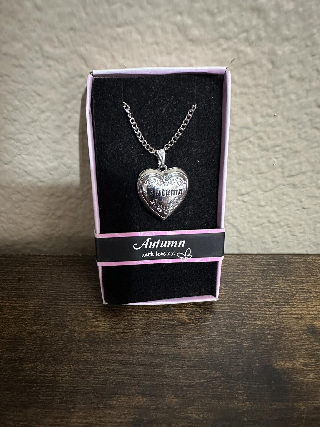 Silver-tone heart locket necklace with engraved “Autumn” pendant in box