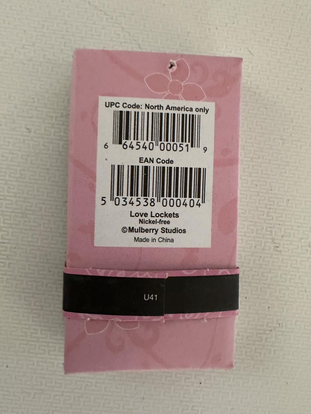 Love Lockets necklace package back label with UPC and EAN codes