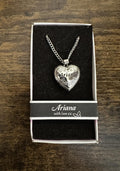 Silver tone heart locket necklace with engraved Ariana on a short chain