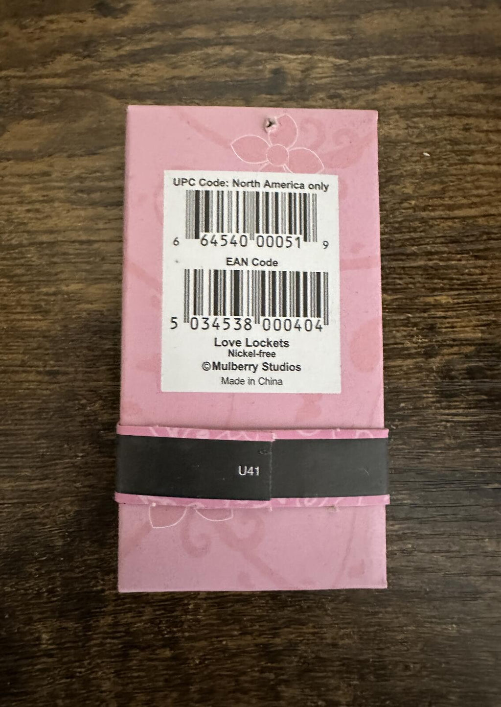 Love Lockets necklace package back with barcode label in pink