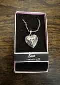 Silver heart locket necklace with engraved “Sam” pendant on chain in gift box
