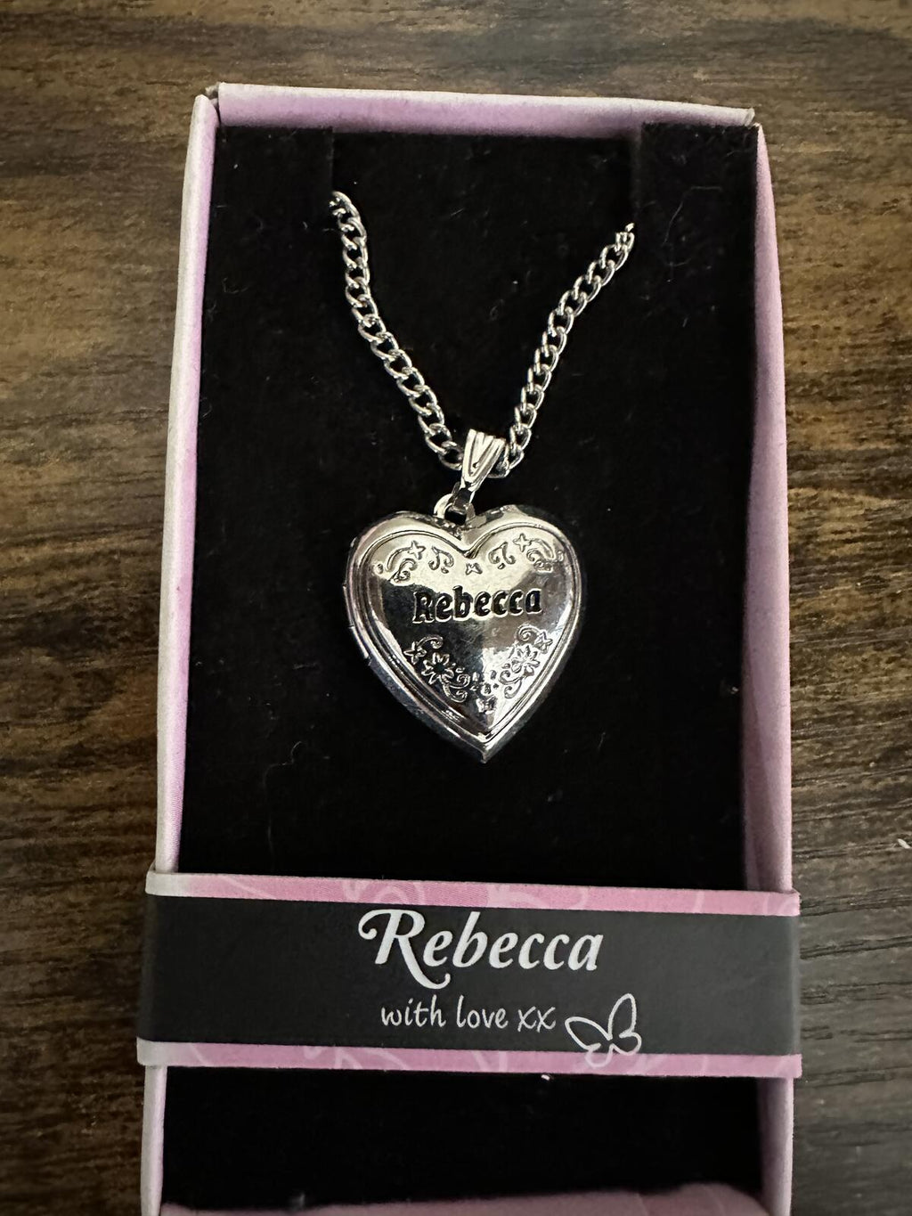 Silver-tone heart locket necklace in box, engraved “Rebecca” pendant and chain.
