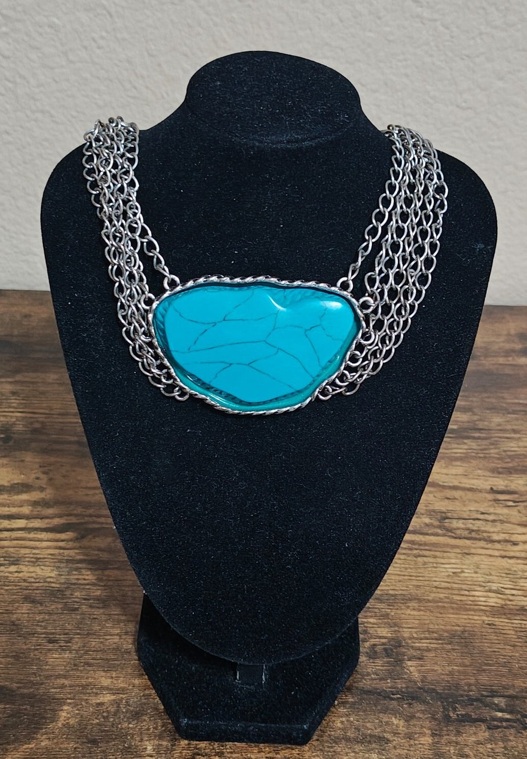 Silver Tone Multi Strand Chain Statement Necklace With a Faux Turquoise Stone