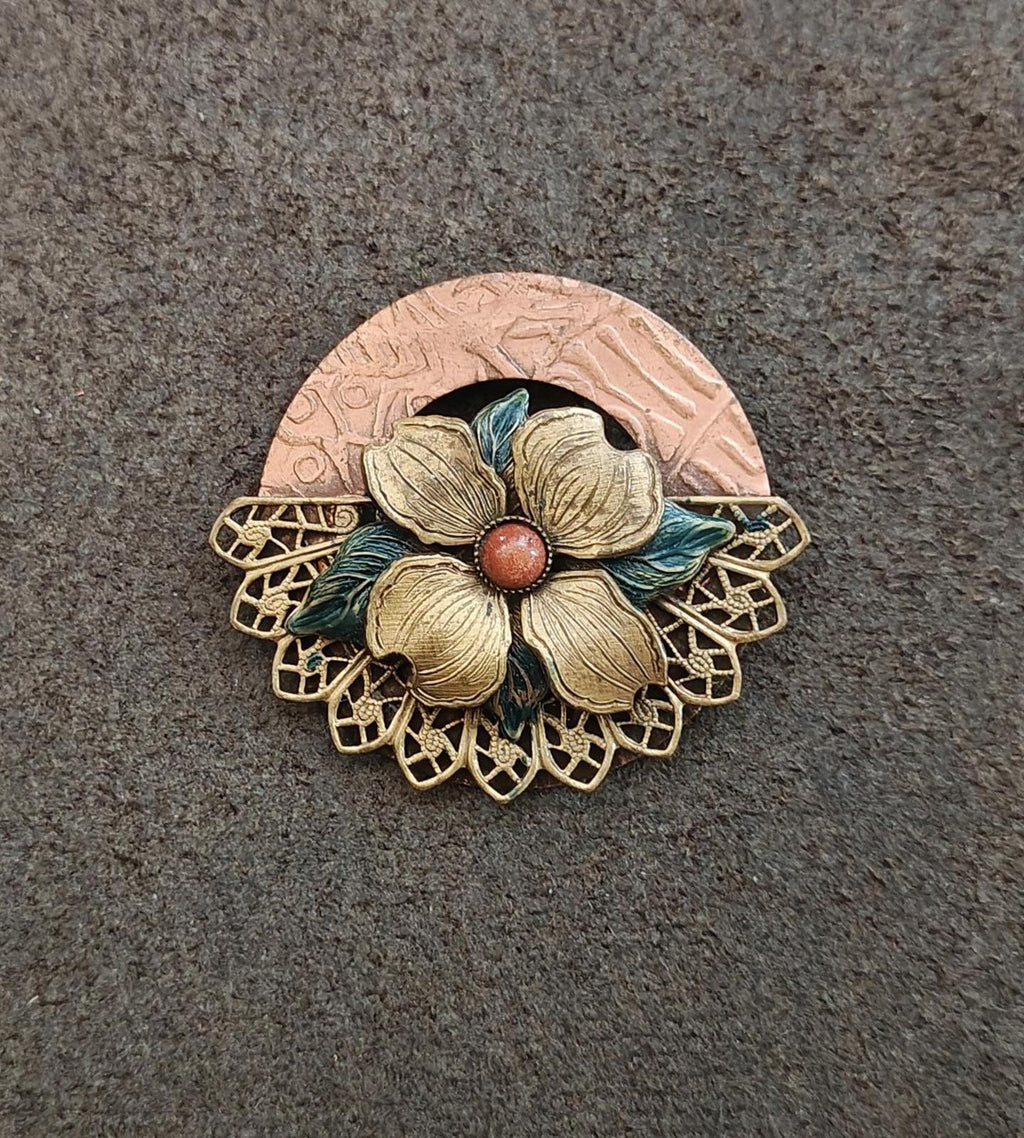 Gold-tone enamel dogwood brooch with red center bead and blue-green leaf accents, round back