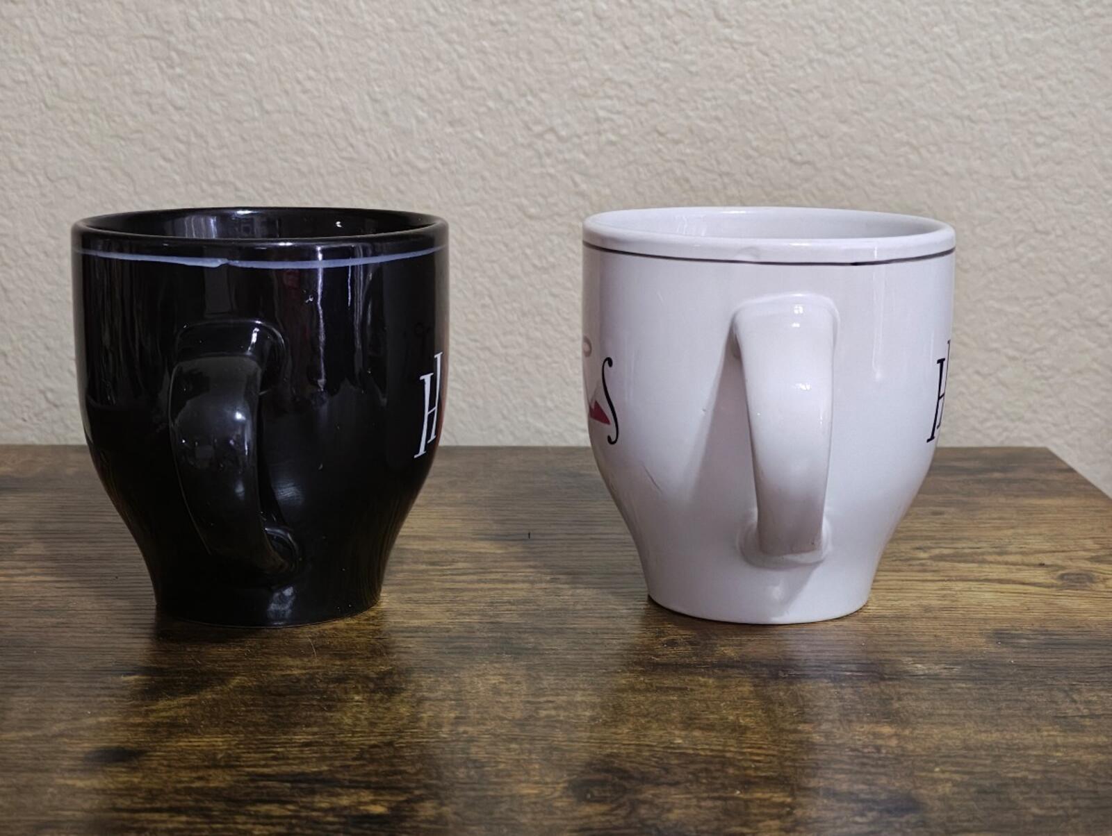 Set of 2 couple mugs, black and white, back sides with partial letters.