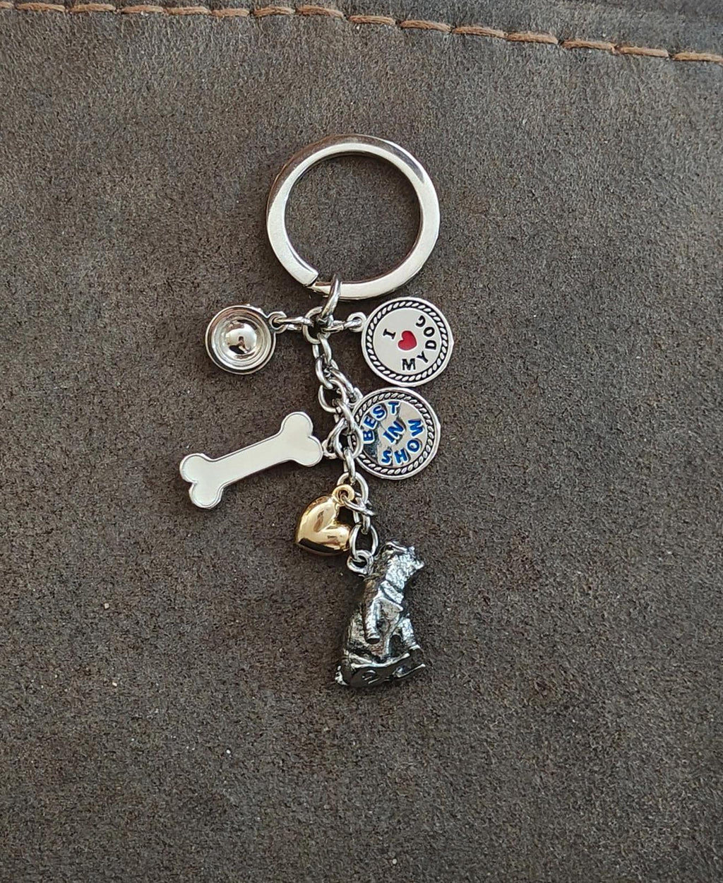 Dog-themed charm keyring with silver ring, dog figure, round “I Love My Dog” disc, and bone