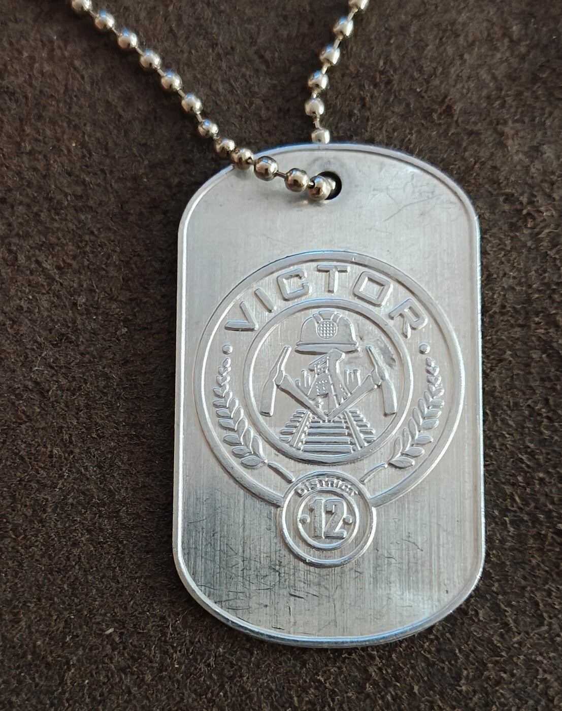 Promotional "The Hunger Games: Catching Fire" District 12 Victor Dog Tag