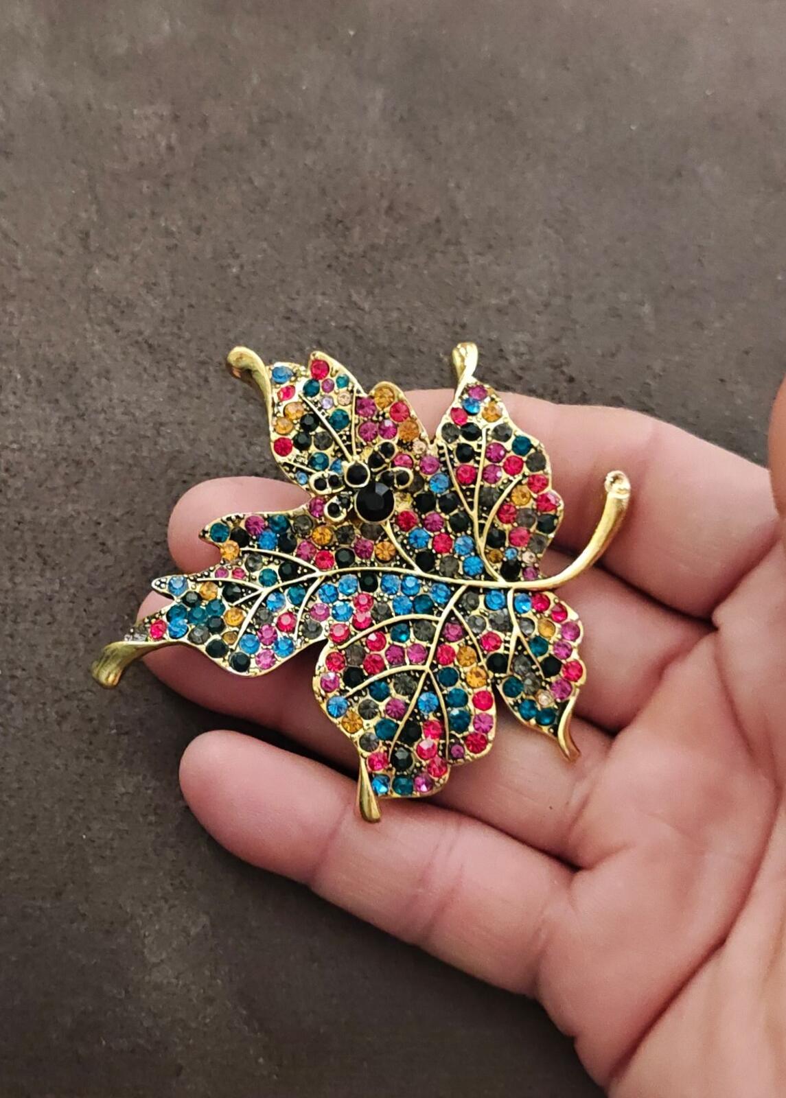 1980s Gold Tone Maple Leaf With Multi Colored Rhinestones Brooch