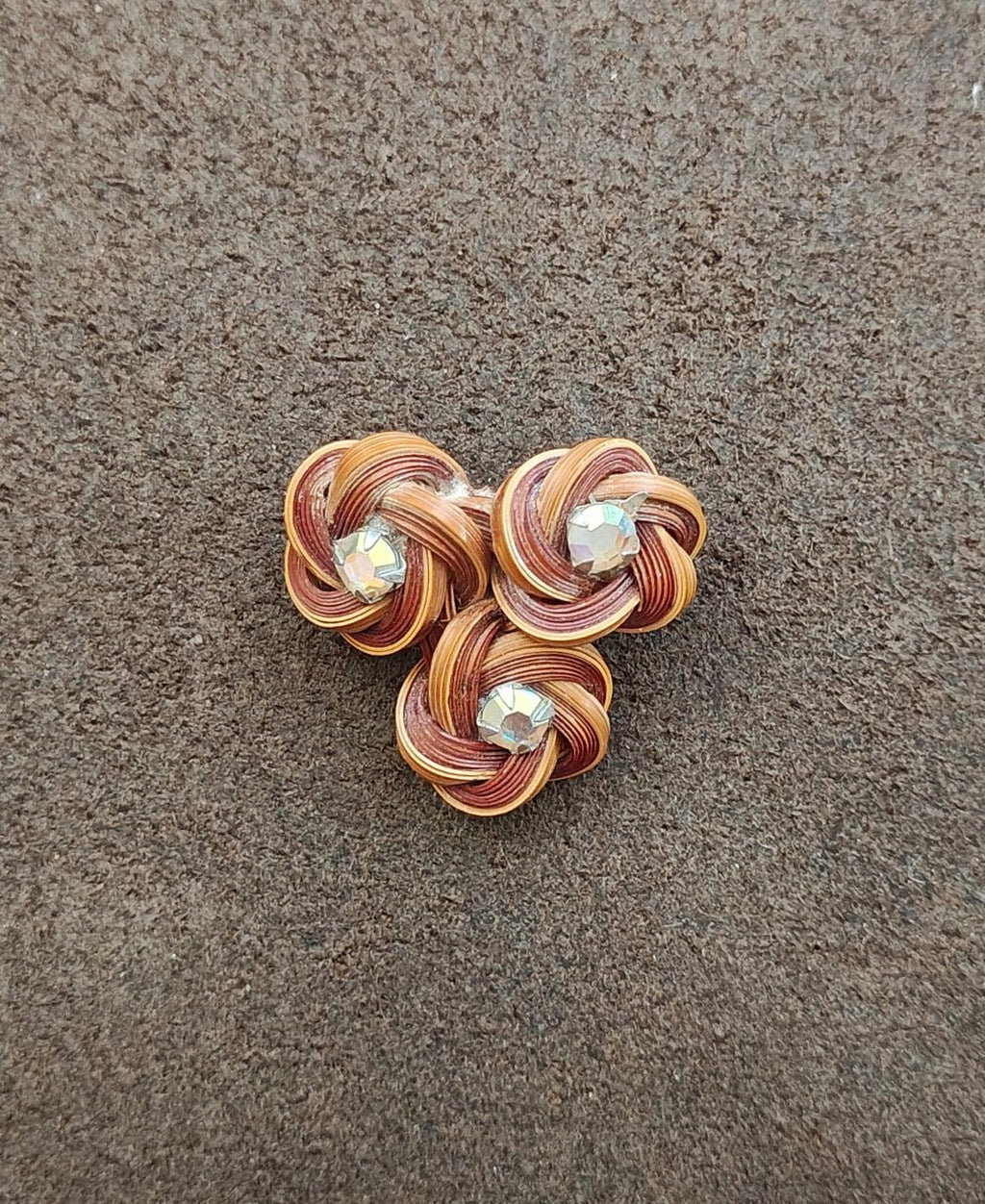 Three-flower bamboo rosette brooch pin with three round rhinestones on brown coil petals