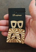 Gold tone hammered statement earrings with black teardrop studs and fan dangles
