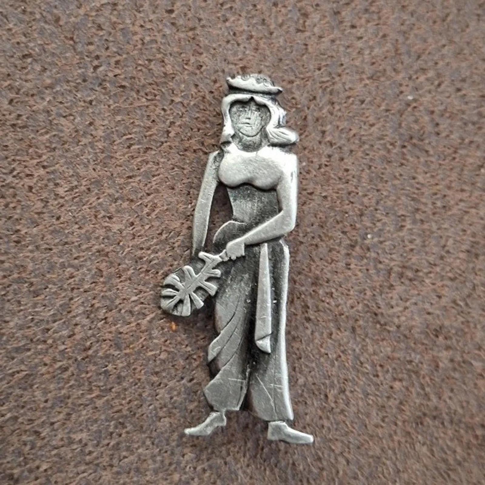 Metzke pewter girl brooch pin, front view with hat and floral accessory, silver-tone