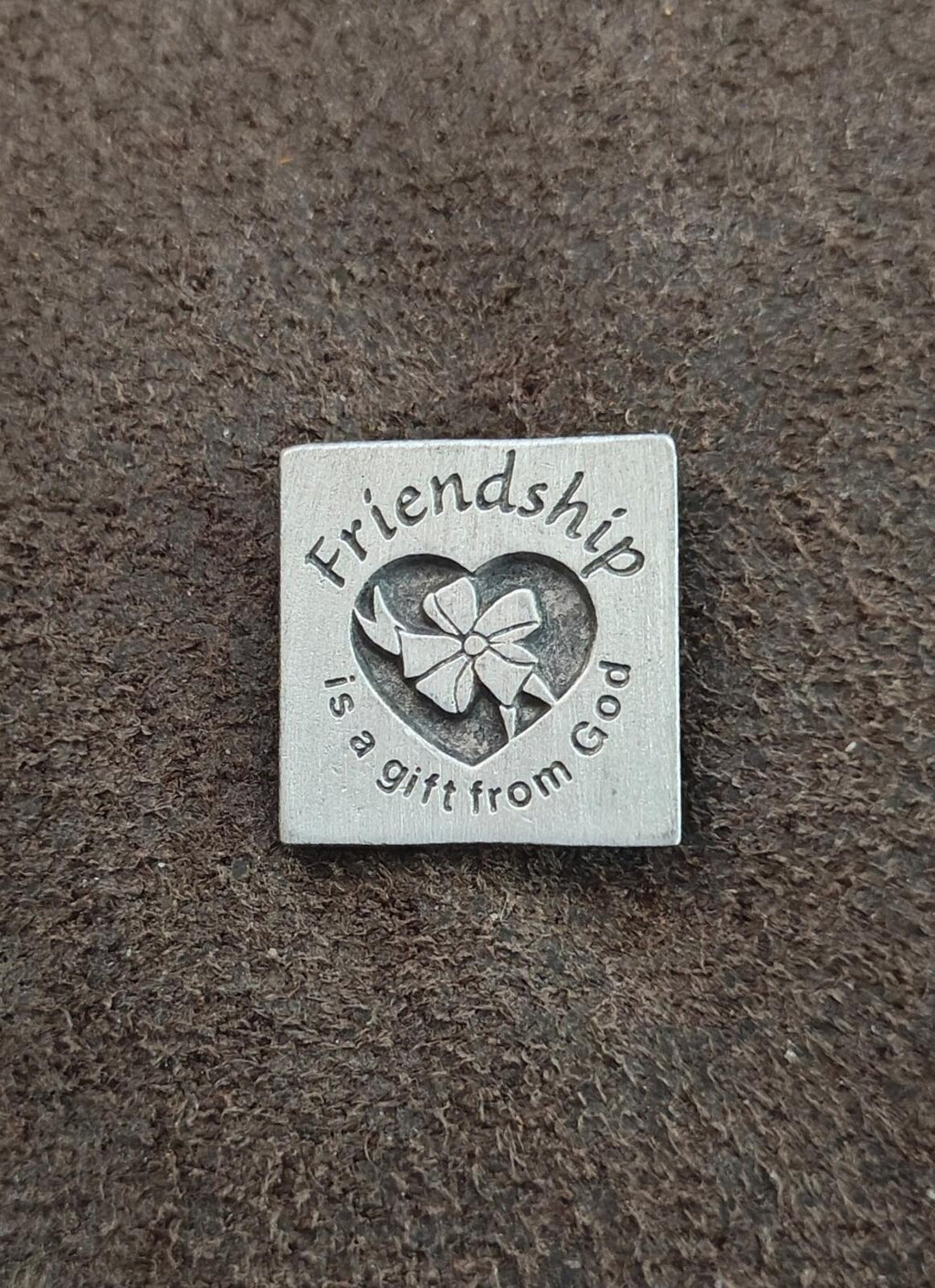 Silver square pin with engraved heart, flower, and friendship wording
