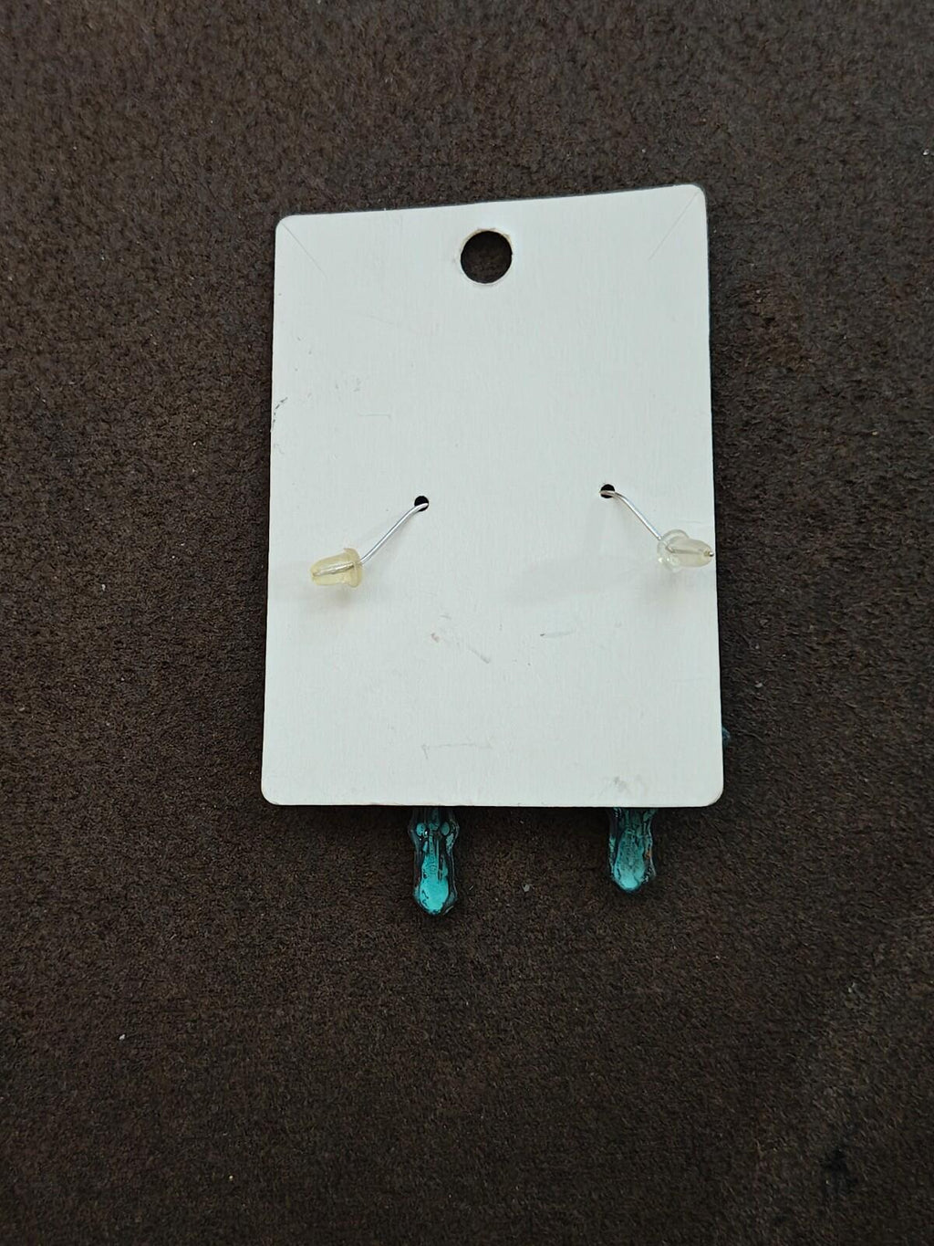 Turquoise cross earrings back view on silver-tone hooks, small bead-and-spring dangles
