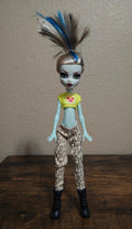 Frankie Stein doll with green top and leopard pants, blue streak hair, black boots