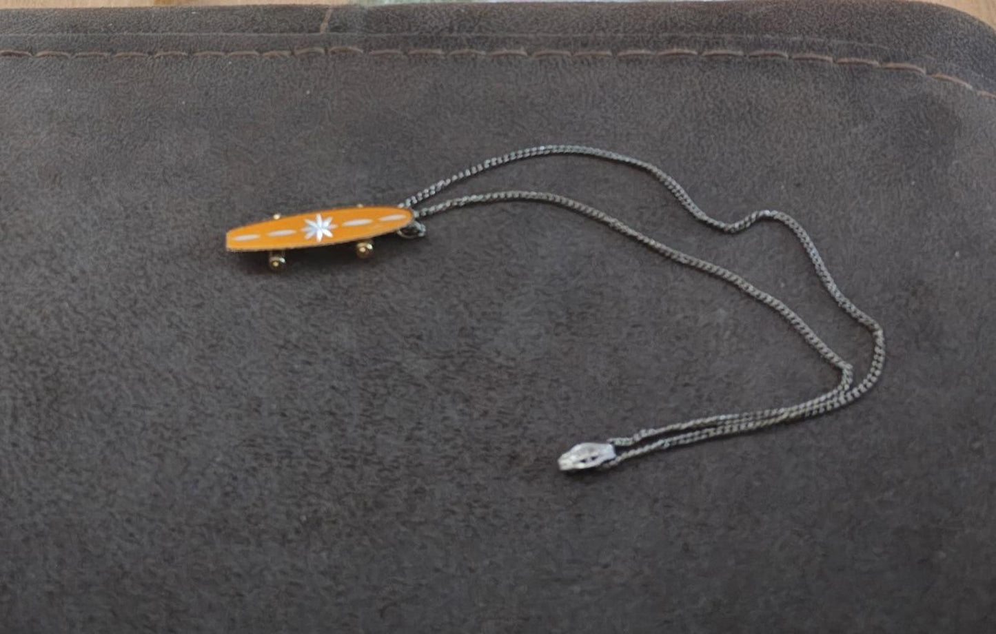 1980's MCM Starburst Skateboard Pendant Necklace with moveable wheels