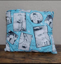 Blue Elvis-themed throw pillow with black-and-white photo collage and starburst accents