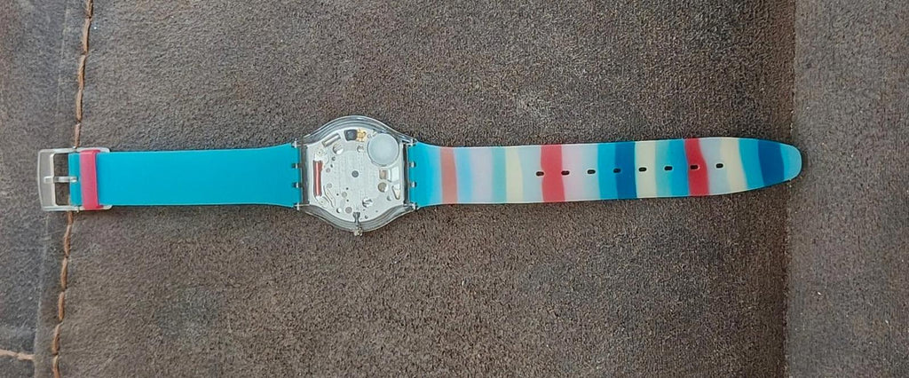 Unisex wristwatch side view with metal case and blue striped silicone strap