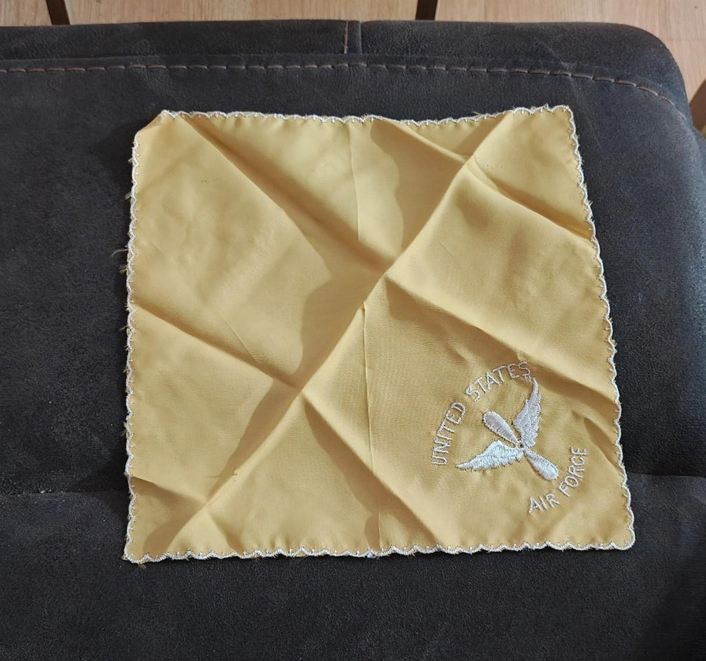 Cream embroidered handkerchief square with white scalloped trim and Air Force emblem