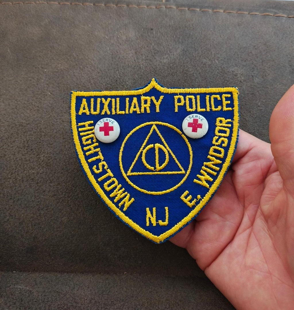Blue auxiliary police patch with yellow edging, showing Highstown NJ and E. Windsor text