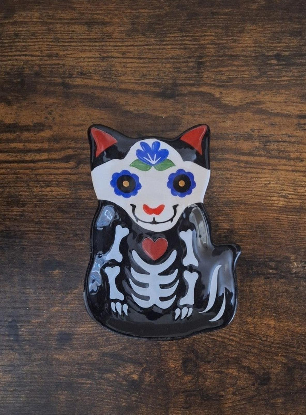Black 3D cat sugar skull trinket plate with blue floral crown and red heart on chest