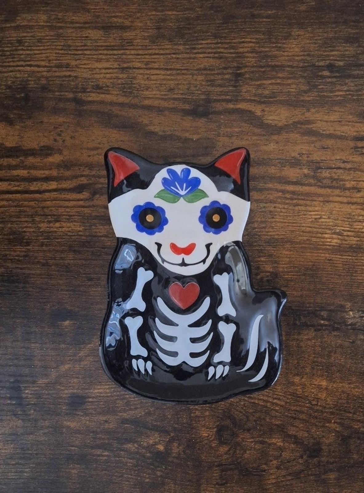 Black 3D cat sugar skull trinket plate with blue floral crown and red heart on chest