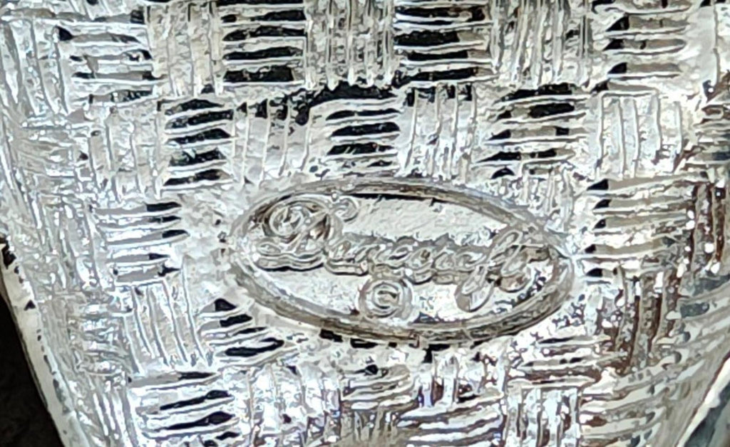 Silver-tone back of the tooth and toothbrush pin with ornate crest relief details.