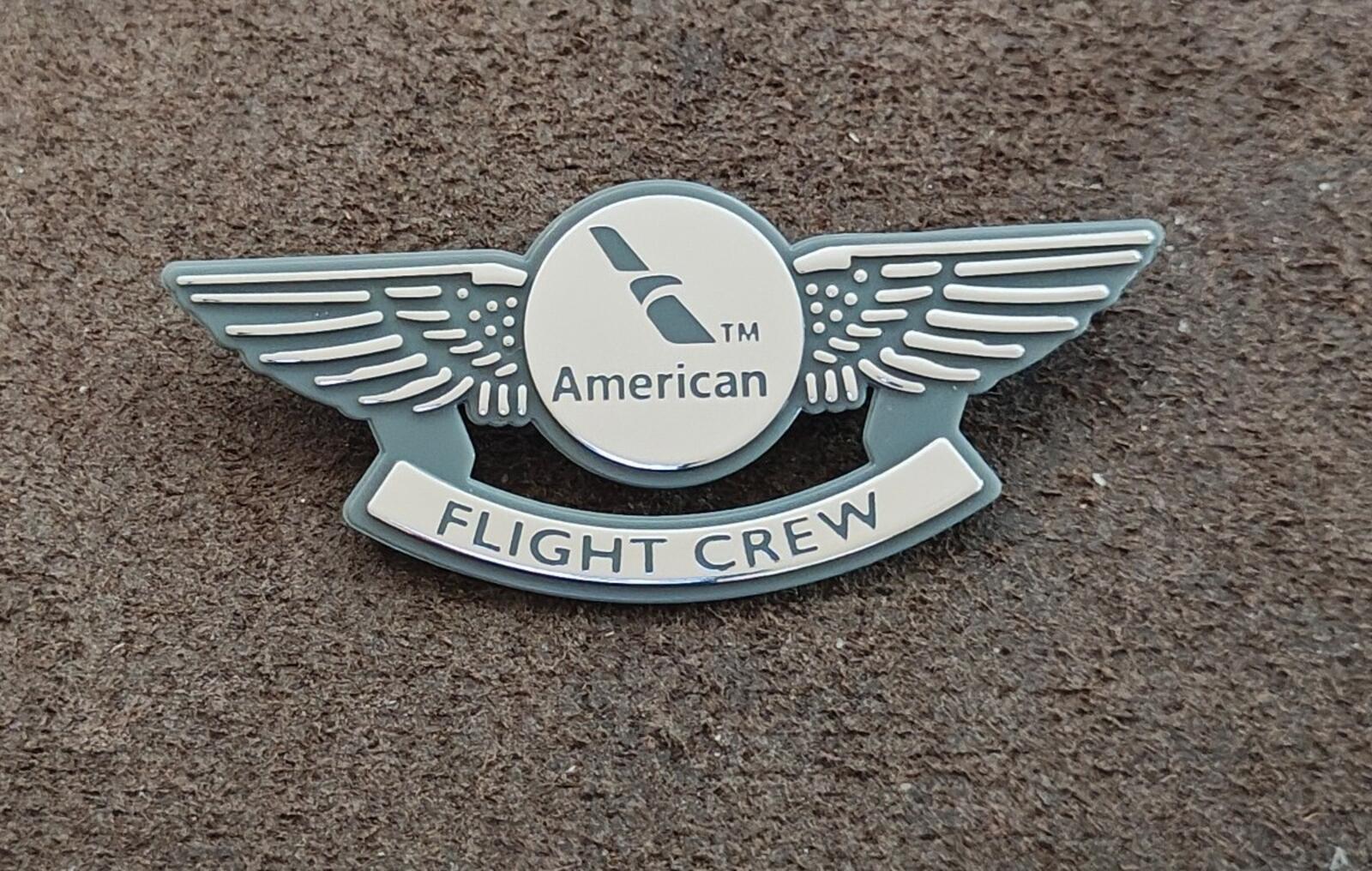 American Flight Crew badge pin front on surface, winged emblem with 'FLIGHT CREW'