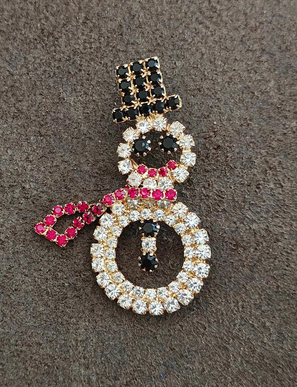 Rhinestone snowman brooch on fabric, gold-tone with black accents, red scarf, clear stones