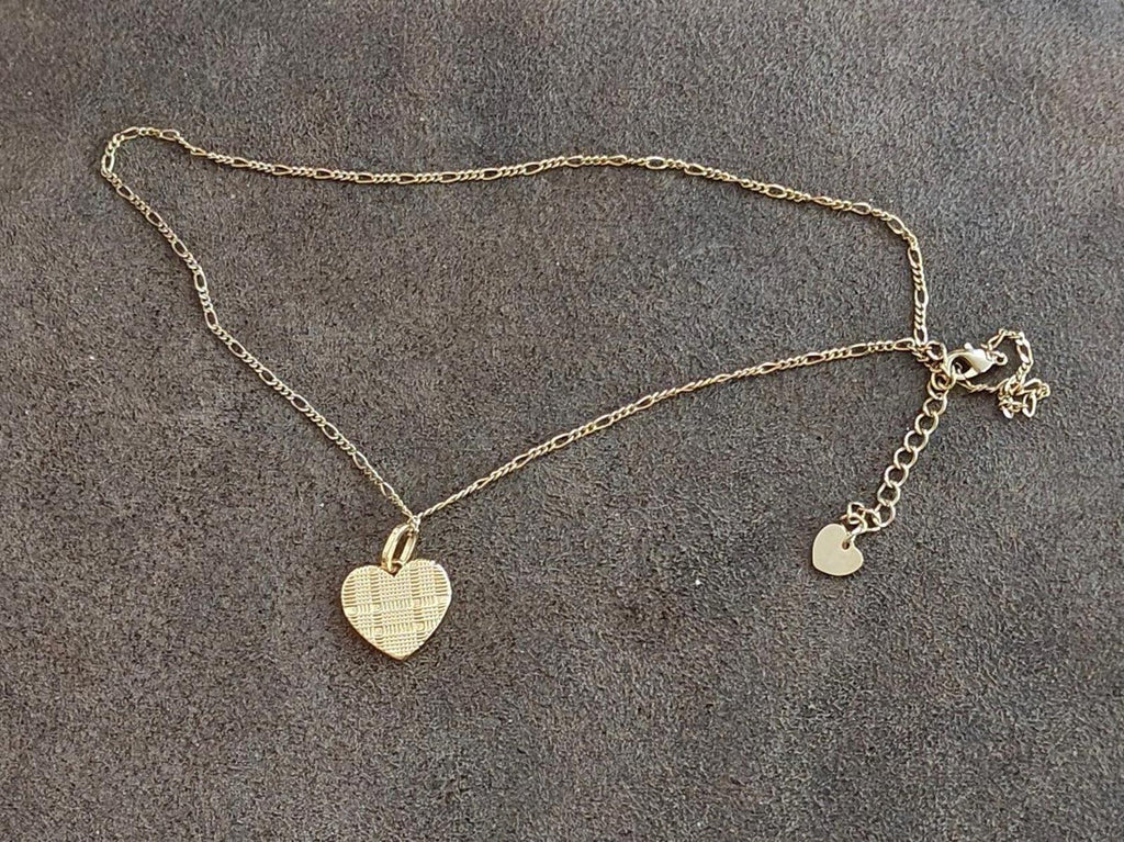 Gold tone heart pendant necklace with small heart charms on chain